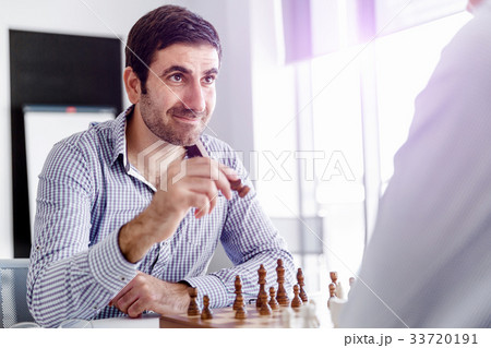 Portrait of two young man playing chess Portrait of two young man playing chess 33720191