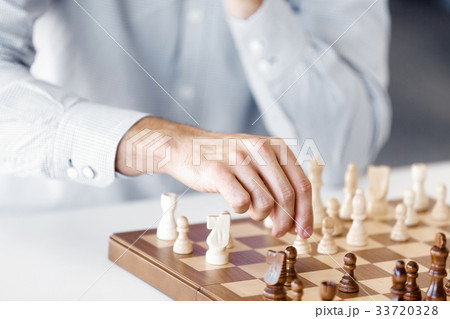 Portrait of two young man playing chess Portrait of two young man playing chess 33720328