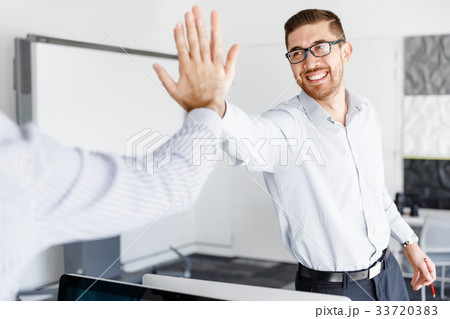 Two handsome businessmen in office Two handsome businessmen in office 33720383