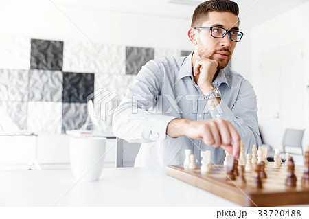 Portrait of two young man playing chess 33720488