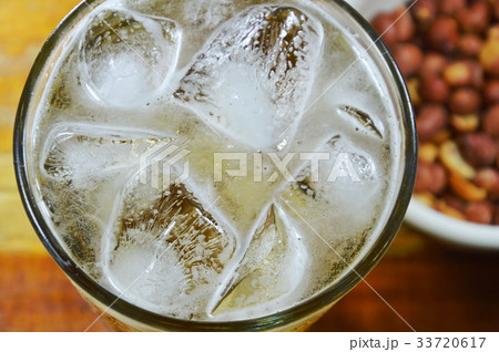 salt peanut and beer on table 33720617