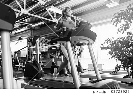 Young fitness woman doing cardio exercises at the 33723922