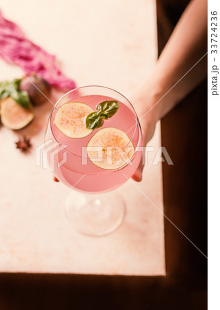 Pink cocktail with fig 33724236