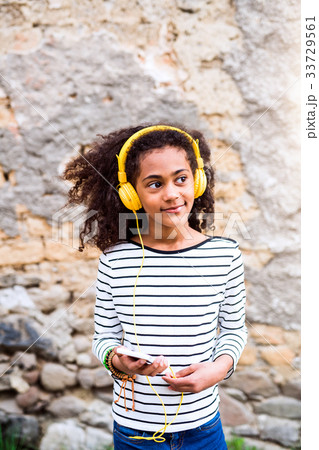 Beautiful african american girl with smart phone Beautiful african american girl with smart phone 33729561