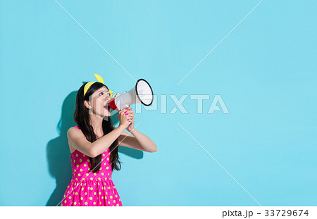 happy beautiful woman using megaphone speaking 33729674