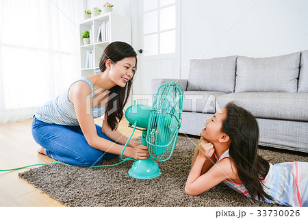 children girl lying down on living room floor 33730026