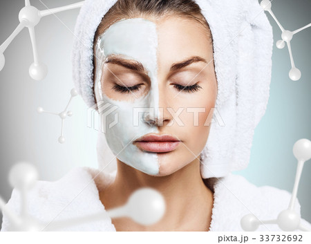 Woman with mask on face among molecules 33732692