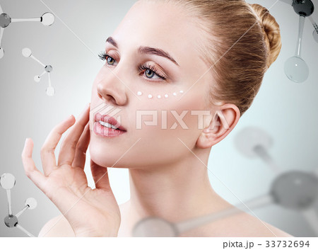 Beautiful toyng woman among molecules. 33732694