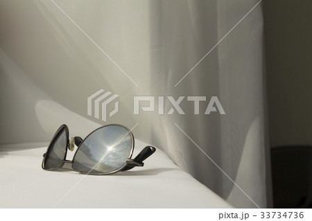 Black man sunglasses on white cloth background 33734736