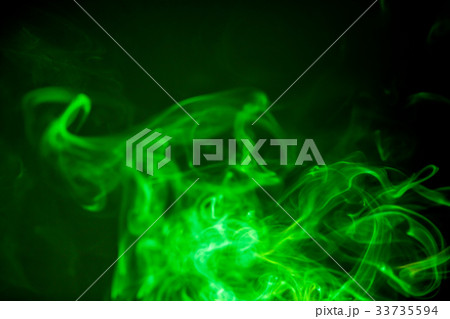 Green smoke motion on black background. 33735594