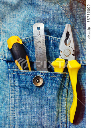 Engineering tools in jeans jacket pocket 33736009