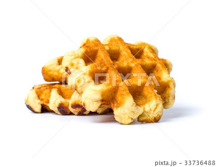 Baked waffles isolated on white background Baked waffles isolated on white background 33736488
