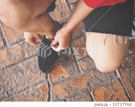 Woman tying running shoe laces 33737768