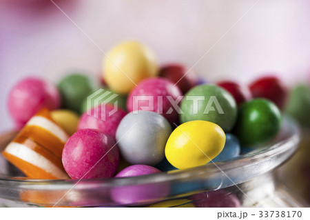 Assorted candies including lollipops, gum balls 33738170