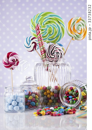 Colorful candies in jars on table on gum balls Colorful candies in jars on table on gum balls 33738232