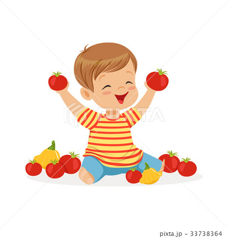Happy little boy sitting on the floor playing with Happy little boy sitting on the floor playing with 33738364