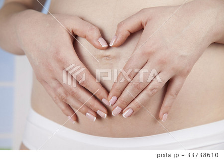 Hand heart, Beautiful Pregnant Woman belly 33738610