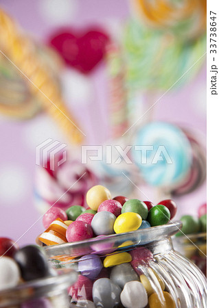 Assorted candies including lollipops, gum balls 33738647