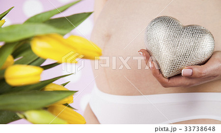 Close up of a cute pregnant belly, Heart Close up of a cute pregnant belly, Heart 33738648