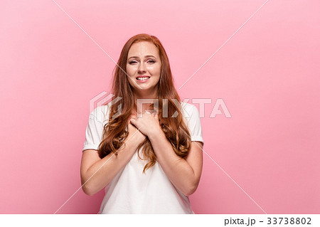 The beautiful woman is offended on pink studio 33738802