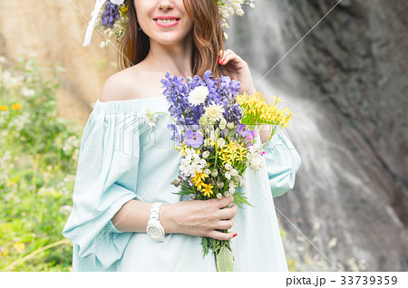 Portrait of a girl with a wreath on her head and a Portrait of a girl with a wreath on her head and a 33739359