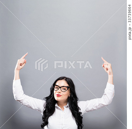 Woman reaching and looking upwards 33739664