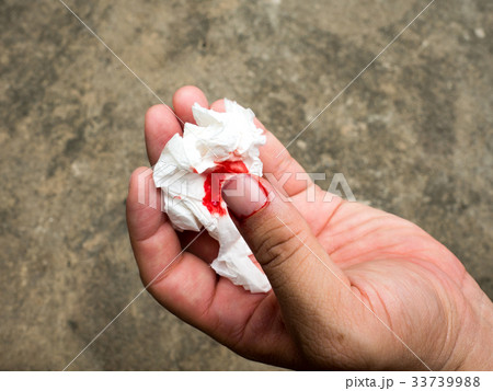 Hand holding paper for blood lining. Hand holding paper for blood lining. 33739988