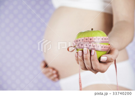 Apple, Pregnancy woman, healthy lifestyle concept Apple, Pregnancy woman, healthy lifestyle concept 33740200
