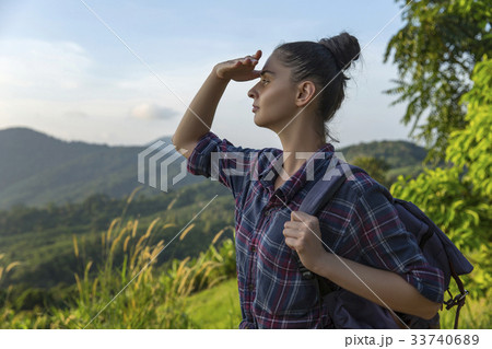 Hipster young girl with backpack enjoying sunset Hipster young girl with backpack enjoying sunset 33740689