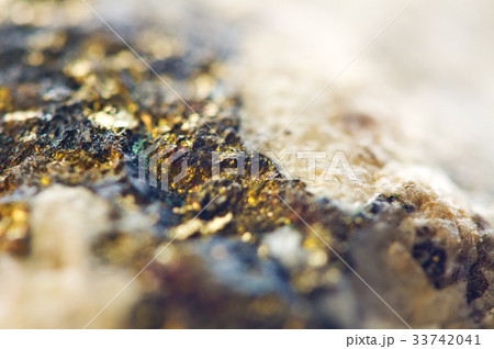 Golden background from natural mineral. Macro 33742041