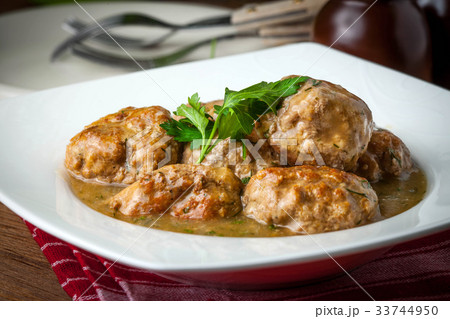Pork meatballs with dill sauce. 33744950