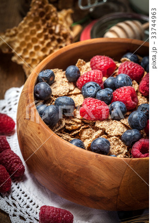 Tasty breakfast with cereal and frut. Tasty breakfast with cereal and frut. 33744963