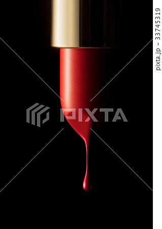 Red lipstick on black background 33745319