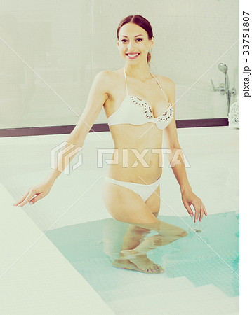 Girl in bikini posing in hot tub 33751807
