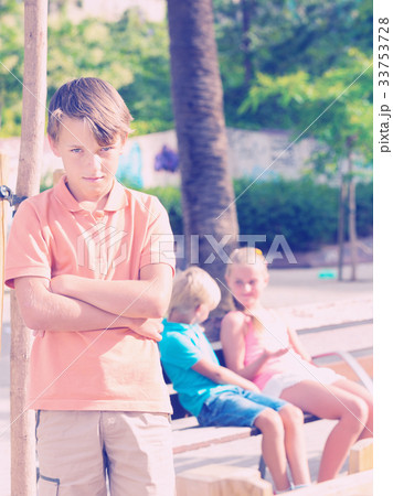 Portrait of boy 8-11 years old which is taking offense on his friends Portrait of boy 8-11 years old which is taking offense on his friends 33753728