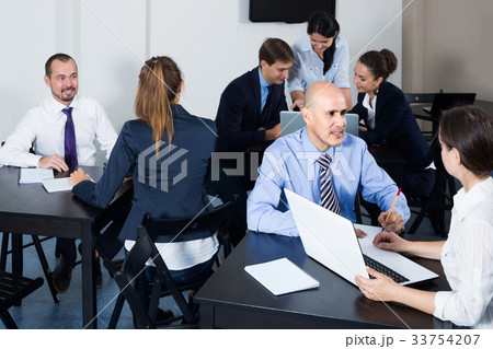 People working productively on business project together 33754207