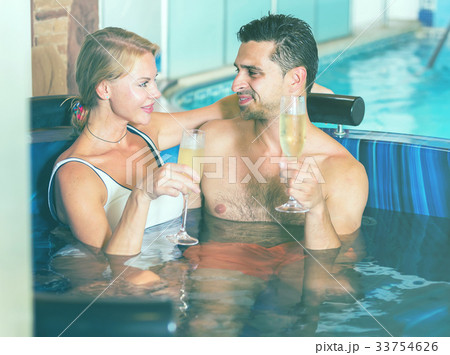 Couple is drinking champagne while resting 33754626