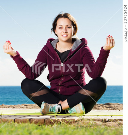 woman working out in beach woman working out in beach 33755424