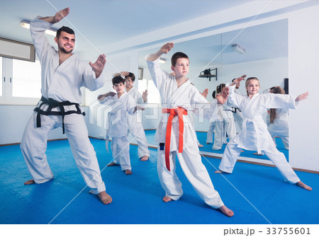 Young children attempting to master new moves Young children attempting to master new moves 33755601