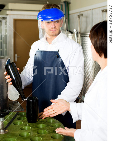 Male worker working with machine Male worker working with machine 33755737