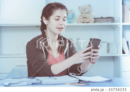 Girl using phone Girl using phone 33756235