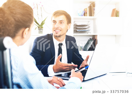 Man manager sitting and working on computer 33757036