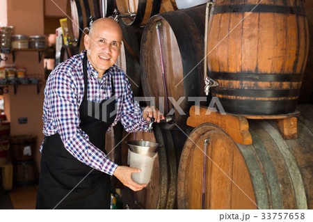 man holding wine in wine house man holding wine in wine house 33757658