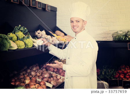 Man cook deciding on best vegetables Man cook deciding on best vegetables 33757659