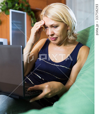 Crying woman receiving bad news 33758293