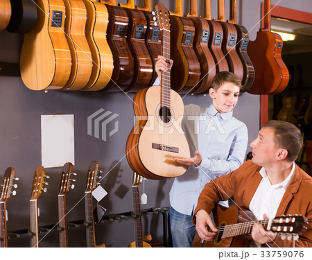 Younker shows an acoustic guitar 33759076