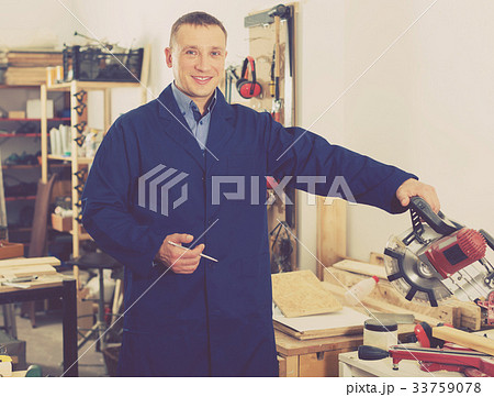 Woodworker posing in workshop Woodworker posing in workshop 33759078