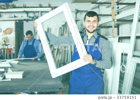 Laborer is demonstrating the window frame 33759151