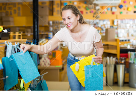 young girl chooses accessories for gift young girl chooses accessories for gift 33760808