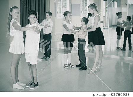 Group of children dancing tango in dance studio Group of children dancing tango in dance studio 33760983